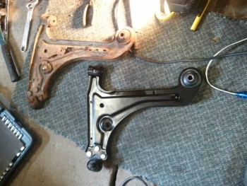 lower control arm new and old.jpg