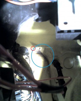 Leak is in the aqua ring -a spider that failed to hold the crack secure with his/her web is in the red ring.  He/she was evicted for the web's failure... ;)