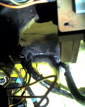 From inside, under the dash, I finally decided just to use a construction-grade flexible, paintable sealer on the inside.  I've used it before, but I haven't seen long-term tests on it yet, so we will see.