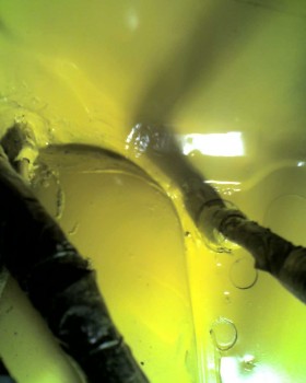 I let the sealant cure over the weekend, and topped it off with Rustoleum's "7747 Sunburst Yellow",which is darn near a perfect color-match for the car.