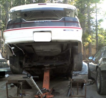 Even the ramps I had here didn't give me the room I wanted to drop the tank, so I used my long-frame jack for more clearance.