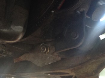 image1(2).JPG (772.84 KiB) Viewed 16460 times The tranny mount. This plate is bolted to the bottom of the Muncie out of the way. The large bolt (from the original mount of an older Beretta) is pinned-down on the other end by a rubber-coated aluminum saddle that is in turn bolted to the subframe.